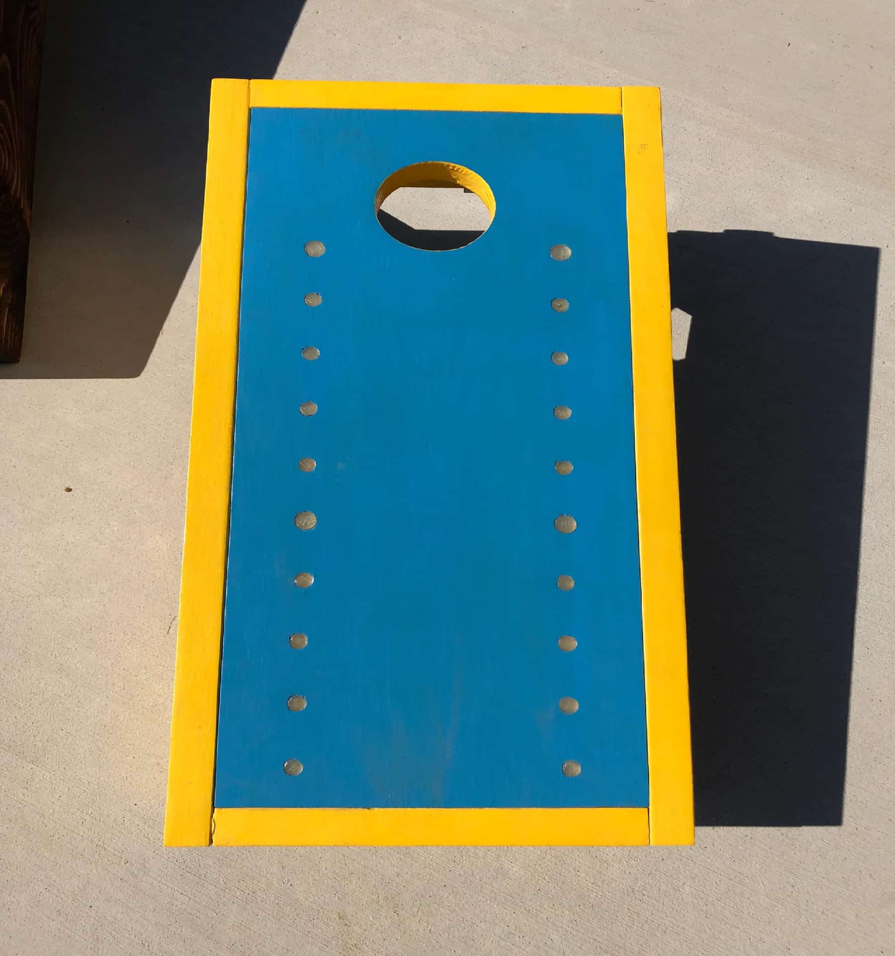 Early YoreBoard prototype in yellow and blue, showcasing design with Scoring LED holes.